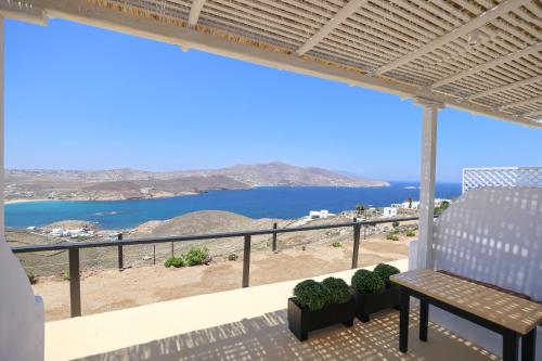 a view of the ocean from the balcony of a house at ēnNĒ Studios for Views & Tranquility in Elia