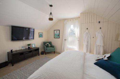 Un pat sau paturi într-o cameră la Los Alamos Roadhouse