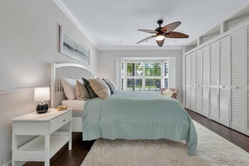 a bedroom with a bed and a ceiling fan at Waterfront Oasis w/ Pool Minutes to Downtown! in Boynton Beach