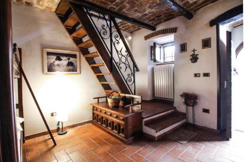 a hallway with a spiral staircase in a house at Santo'S House BnB in Santo Stefano di Sessanio