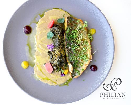 a plate of food with tacos on a white plate at Skiathos Avaton Hotel, Philian Hotels & Resorts in Skiathos Town