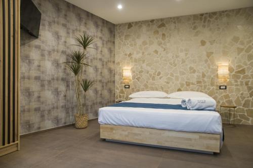 a bedroom with a king sized bed in a room at suite 18 luxury apartments in Bari