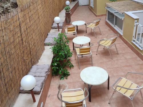an overhead view of a patio with tables and chairs at Kissandros Hotel in Agia Galini