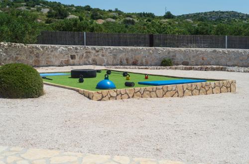 a miniature golf course in the middle of a field at Hacienda Nikolic in Milna