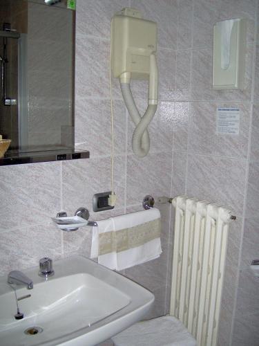 a bathroom with a sink and a mirror at Lago Maggiore in Lesa