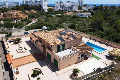 an aerial view of a house with a swimming pool at Villa Domingos by Slow Villas in Calas de Mallorca