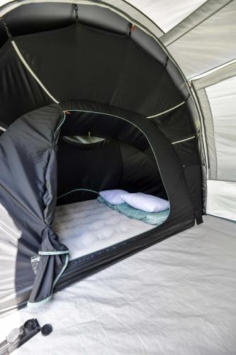 a black tent with a bed in it at KempingZator Namioty in Zator
