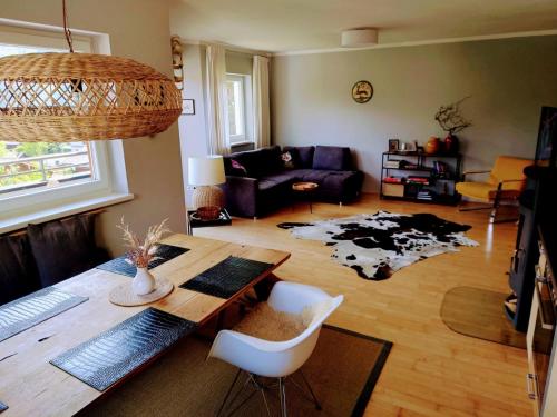 a living room with a table and a couch at The Kitz-View 2 in Fürth