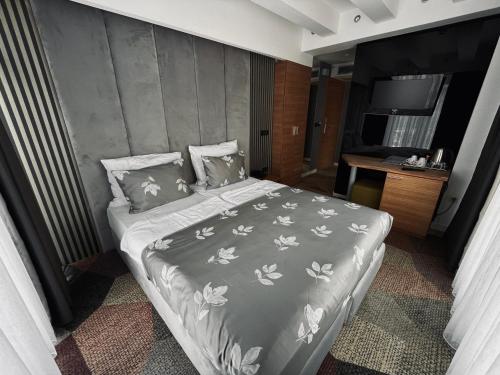 Ένα ή περισσότερα κρεβάτια σε δωμάτιο στο Hotel City View Deluxe