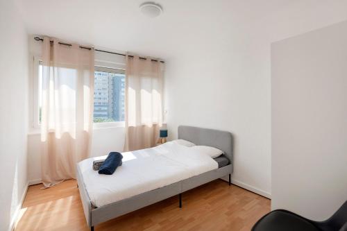 Een bed of bedden in een kamer bij Cocon de Ris - Appartement dans un environnement agréable