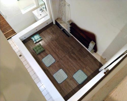 an overhead view of a bathroom with a floor at PURE st-ay in Taipei