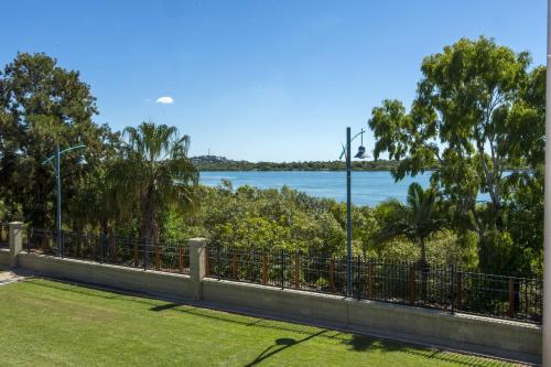 a view of the water from a park at Mid City Motor Inn in Mackay