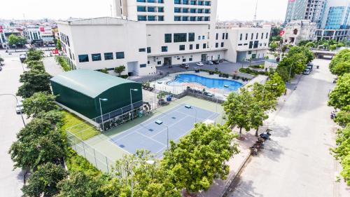 an aerial view of a tennis court in a city at Muong Thanh Luxury Ha Nam in Phủ Lý
