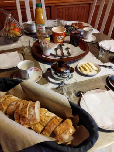a table with a bunch of food on top of it at NOMAD ALP B&B in Marthod