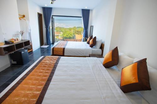 Katil atau katil-katil dalam bilik di Palm Beach Hotel Phu Yen - Kite surfing spot in winter