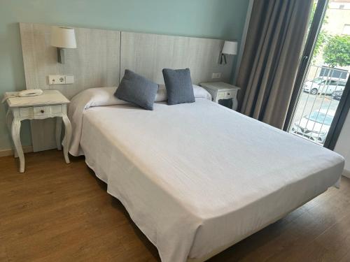 Letto o letti in una camera di Hotel L'Escala Centre