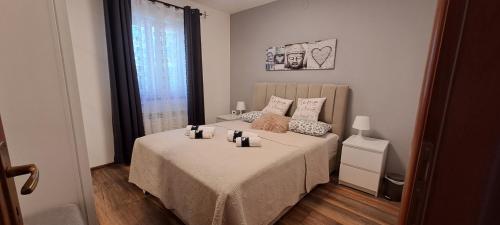 a bedroom with a bed with candles on it at Villa AGAVA in Umag