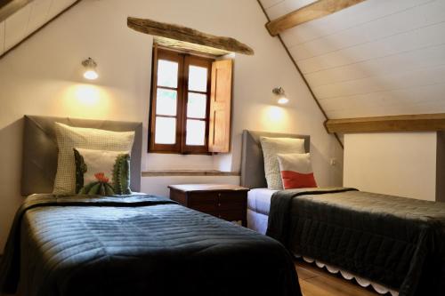 Postel nebo postele na pokoji v ubytování Manoir de l'Isle