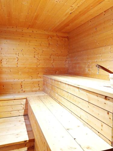 a wooden sauna with wooden floors and ceilings at Las vistas del valle in Hontoba