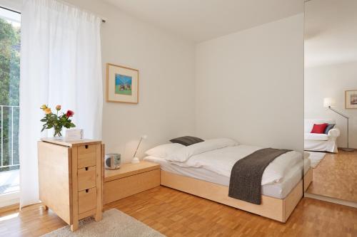 Postel nebo postele na pokoji v ubytování Apartment Schützenmattstrasse 13, SCH1323