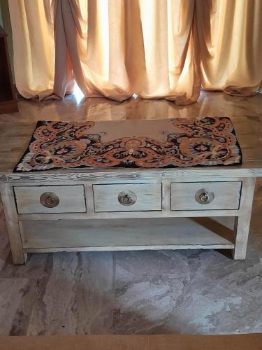 a dresser with a design on the top of it at Georgia's Village House in Kondóstavlos