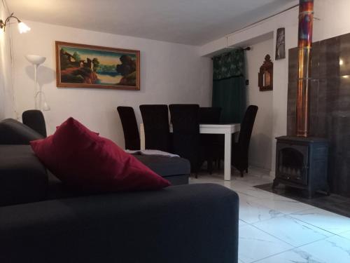 a living room with a couch and a stove at Casa Holmes in Las Casillas