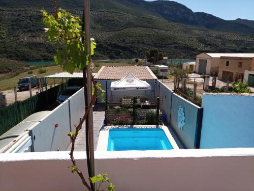 a villa with a swimming pool on top of a house at Casa Holmes in Las Casillas