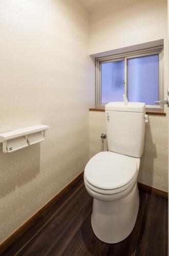 a bathroom with a white toilet and a window at Osaka guest house sakura / Vacation STAY 2409 in Osaka