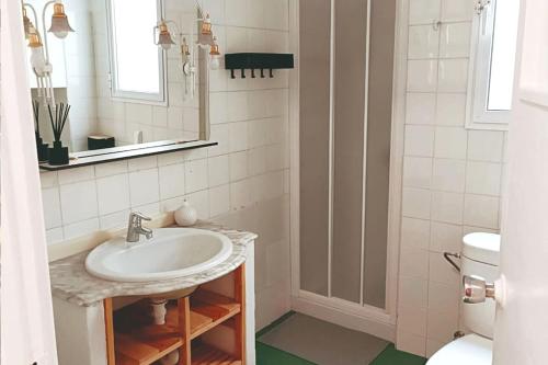 a bathroom with a sink and a toilet at Apartamentos Carrillo 5 in Santa Cruz de Tenerife