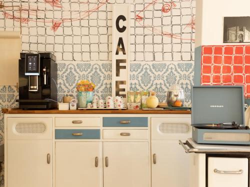 a kitchen with a counter with a laptop on it at Hotel Villa Maris in Rimini