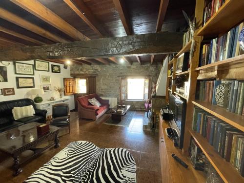 a living room with a zebraebra rug in the middle at Casa Rustica Con Porche in Bostronizo