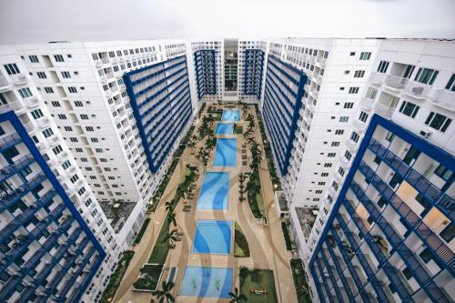 an overhead view of a courtyard between two tall buildings at Reese @ Sea Residences Manila in Manila