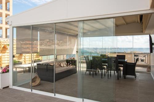 a balcony with a table and chairs on a building at Samaya Sea view in Civitavecchia