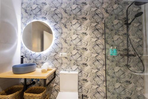 a bathroom with a shower and a mirror at FLORIT FLATS - The Green Apartments in Valencia
