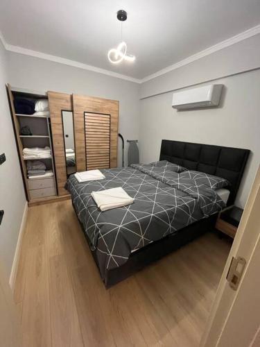 Ένα ή περισσότερα κρεβάτια σε δωμάτιο στο Cordonn residence apart1