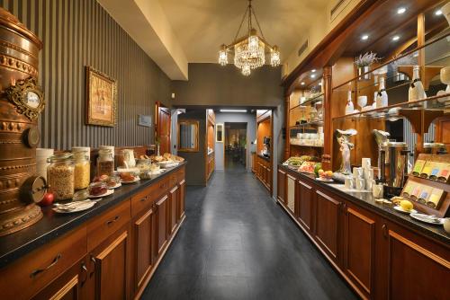 a kitchen with a long counter in a store at City Hotel Morris in Česká Lípa