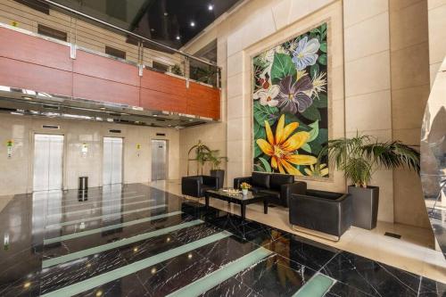 a lobby with a large mural of flowers on the wall at Supurb 2 Bed Room Apt Sea Front (Side View) in Abu Dhabi