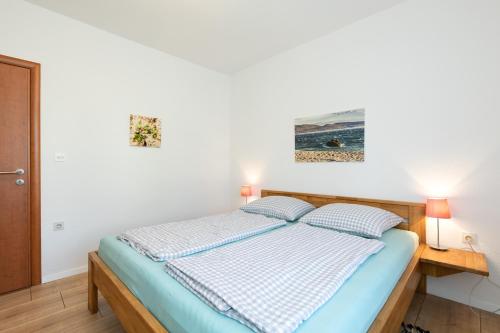 Posteľ alebo postele v izbe v ubytovaní Apartments Oleander