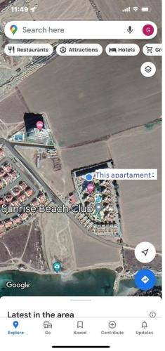 a screenshot of a cell phone with a map at Seaview apartment with roof terrace in Kalecik