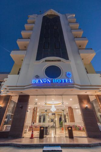 a view of the devon hotel at night at Dexon Roma Hotel in Hurghada
