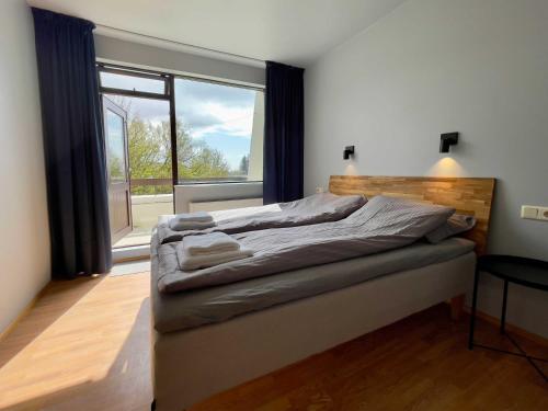 Postel nebo postele na pokoji v ubytování Matkráin Apartments