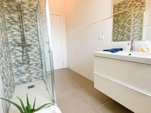 a bathroom with a shower and a sink at CasaJila in Novi Ligure