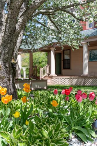 a garden of flowers in front of a house at The Wentworth in Jackson