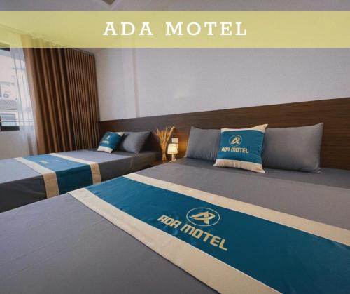 Un pat sau paturi într-o cameră la ADA MOTEL TUẦN CHÂU