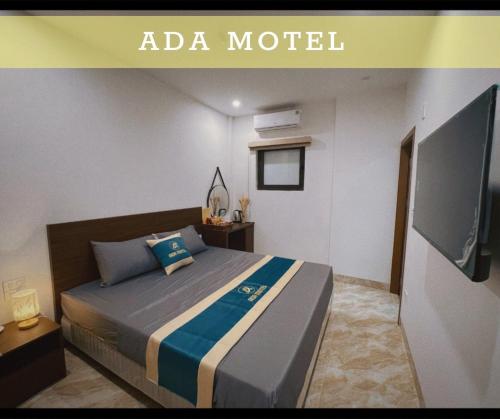 Un pat sau paturi într-o cameră la ADA MOTEL TUẦN CHÂU