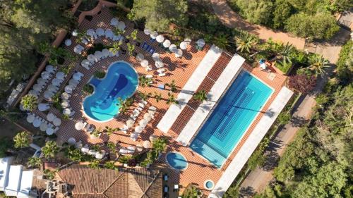 an overhead view of a pool at a resort at FlipFlop Cala Romántica in Cala Romàntica