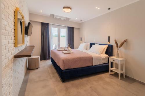 Ένα ή περισσότερα κρεβάτια σε δωμάτιο στο Melena Premium Suites