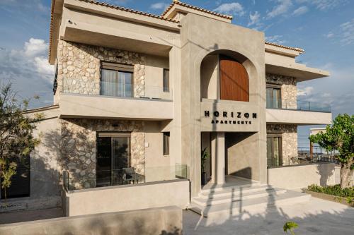a building with a sign that reads northern pharmacy at Horizon Apartments - Beachfront Luxury, by ZanteWize in Laganas