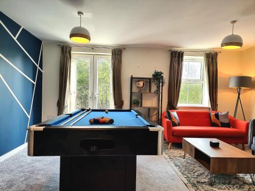 a living room with a pool table in it at Large House with Free Parking and Long Stay Offers in Leicester