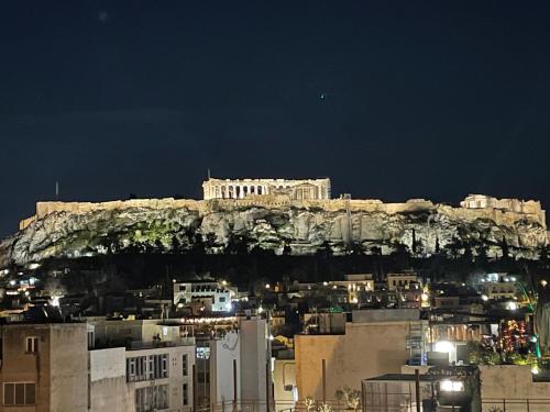 a view of the acropolis of athens at night at Acropolis Panorama View Penthouse with Private Terraces A Contemporary Parthenon in Athens